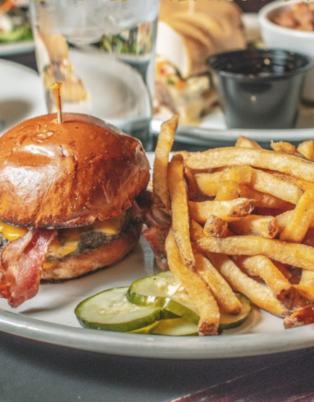 A Fathead Bill's burger with fries and pickles